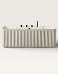 Front view of the Bellastone Kolpa back-to wall bath with black tap ware in cream
