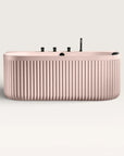 Front view of the Bellastone DORIA Back-to-Wall Bath with Faucet in pink with black tap ware