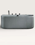 Front view of the Bellastone DORIA Spa Bath in granite-grey with black tap ware