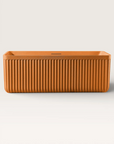 Front view of the Bellastone KOLPA Back-to-Wall Bath in orange