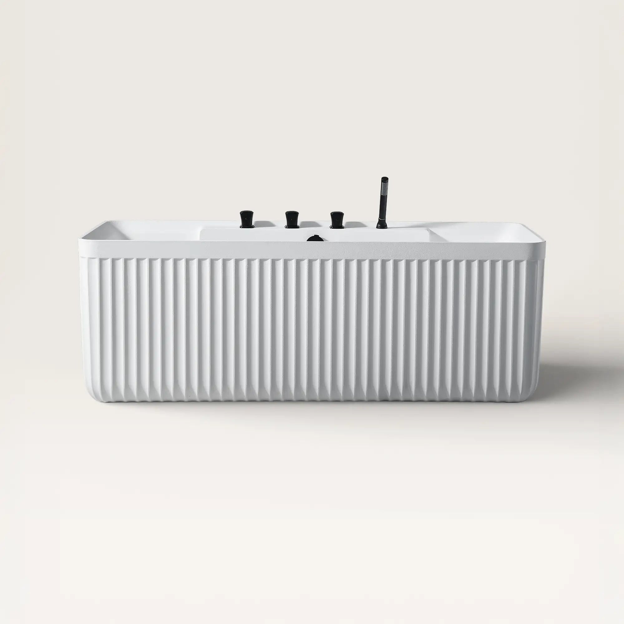 Front view of the Bellastone Kolpa back-to wall bath with black tap ware in white