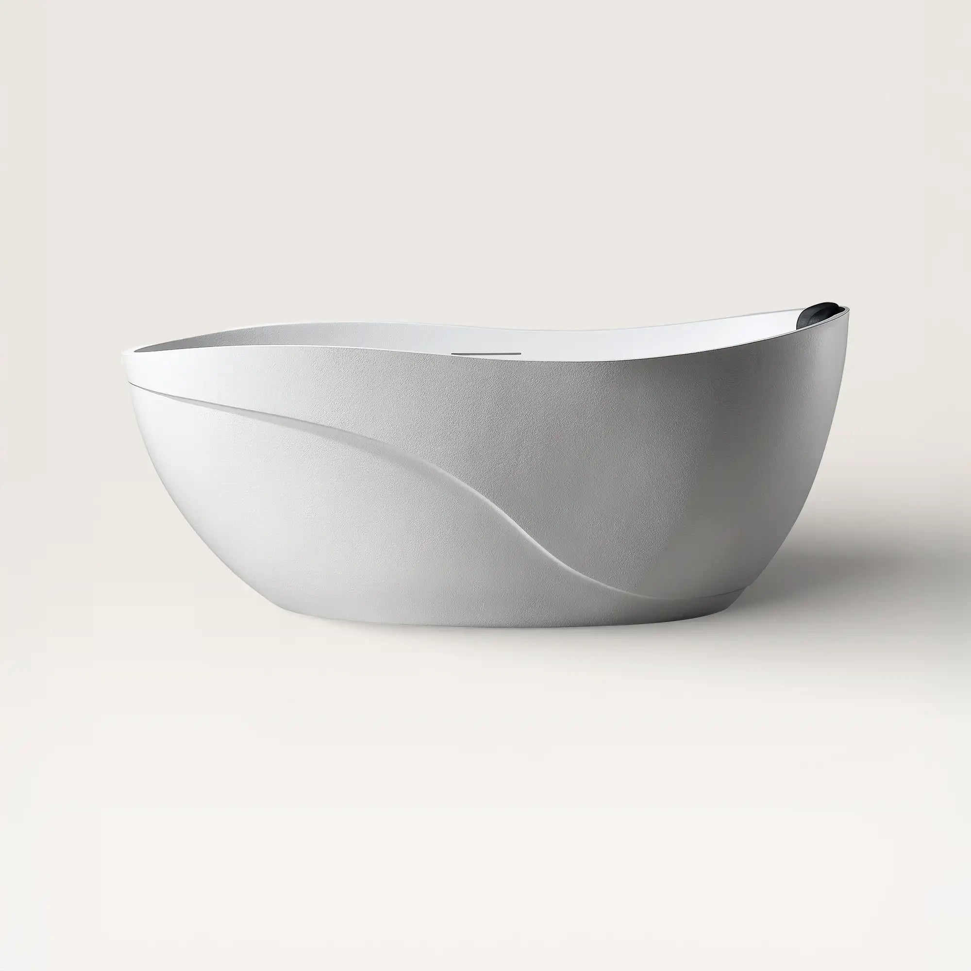 Front view of the Bellastone Soma freestanding bath in white with a black magnetic pillow