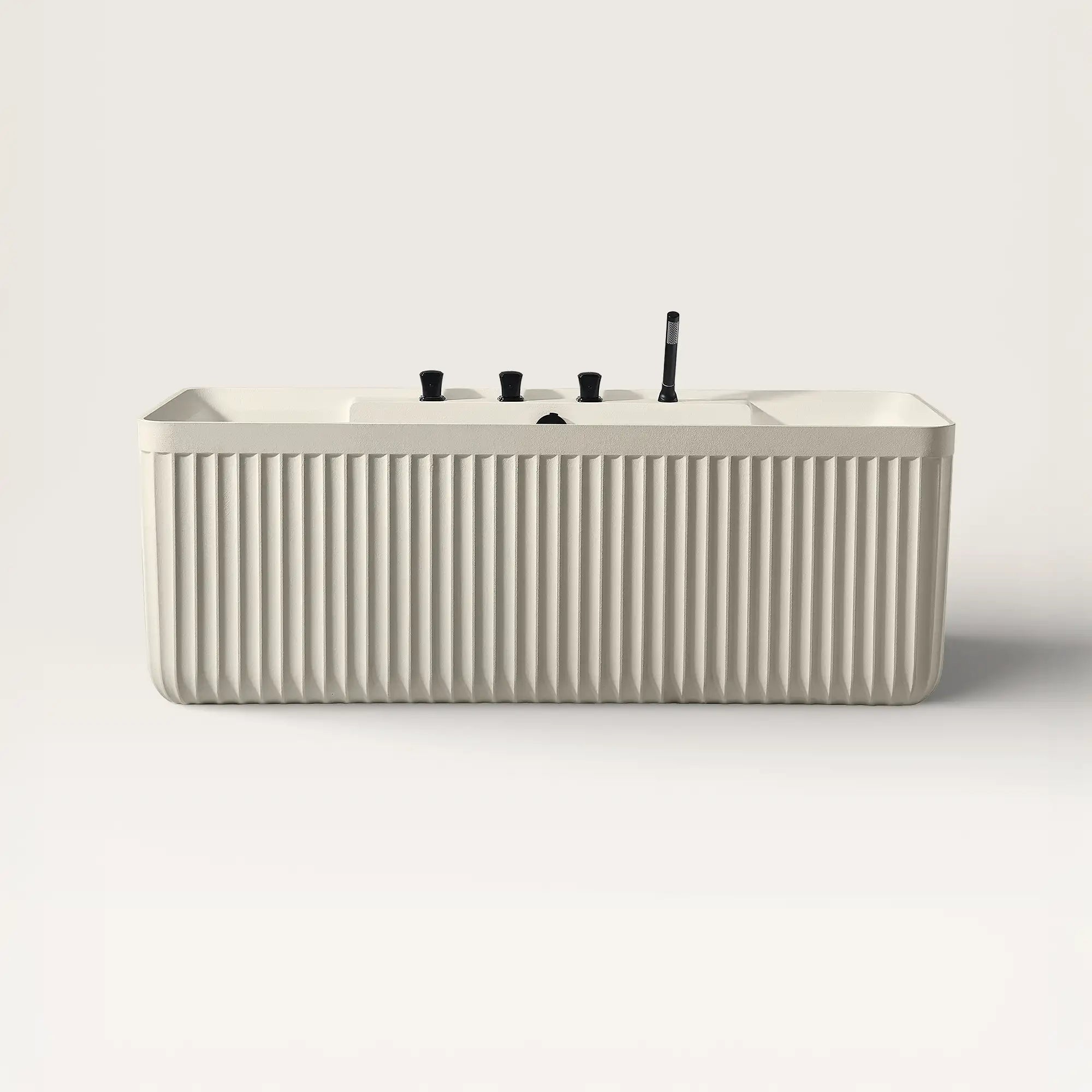 Front view of the Bellastone Kolpa back-to wall bath with black tap ware in cream