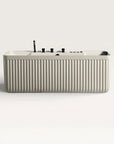 Front view of the Bellastone Kolpa Spa bath with black tap ware in cream