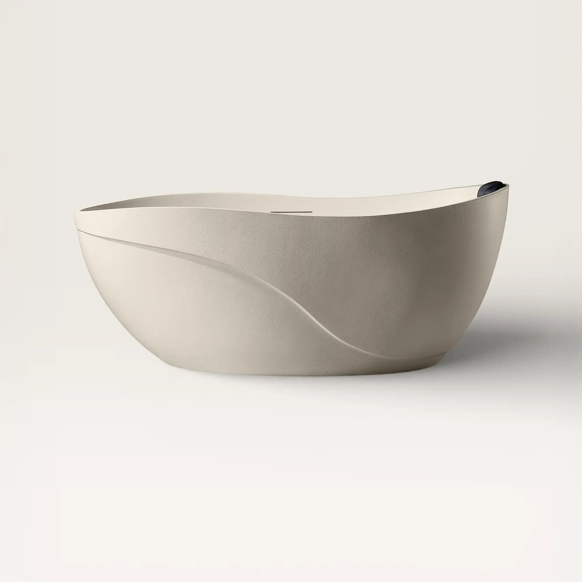 Front view of the Bellastone Soma freestanding bath in cream with a black magnetic pillow