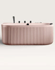 Front view of the Bellastone DORIA Spa Bath in pink with black tap ware