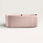 Front view of the Bellastone DORIA Back-to-wall Bath in pink