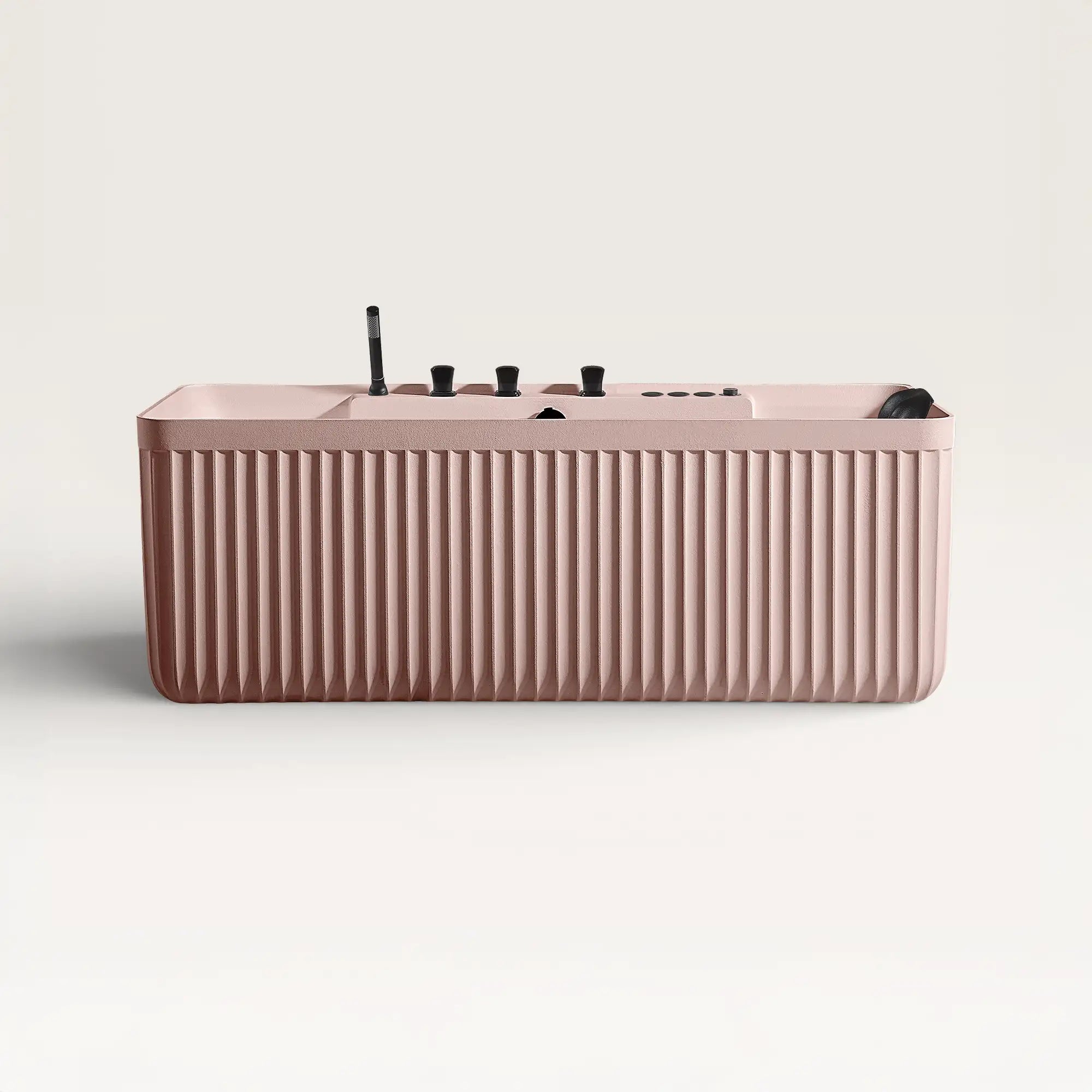 Front view of the Bellastone Kolpa Spa bath with black tap ware in pink