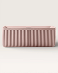 Front view of the Bellastone KOLPA Back-to-Wall Bath in pink