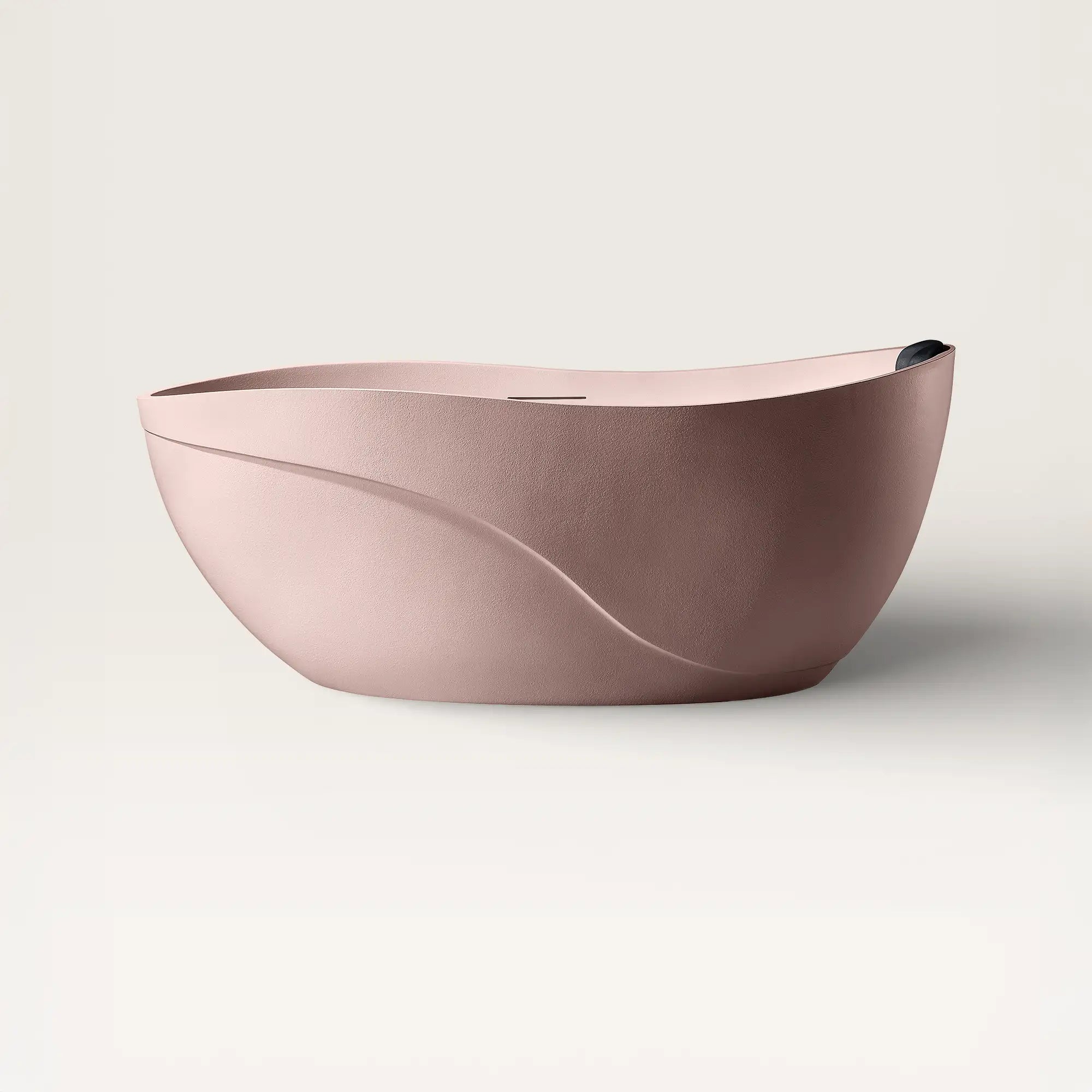Front view of the Bellastone Soma freestanding bath in pink with a black magnetic pillow
