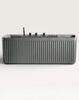 Front view of the Bellastone Kolpa Spa bath with black tap ware in cement-grey