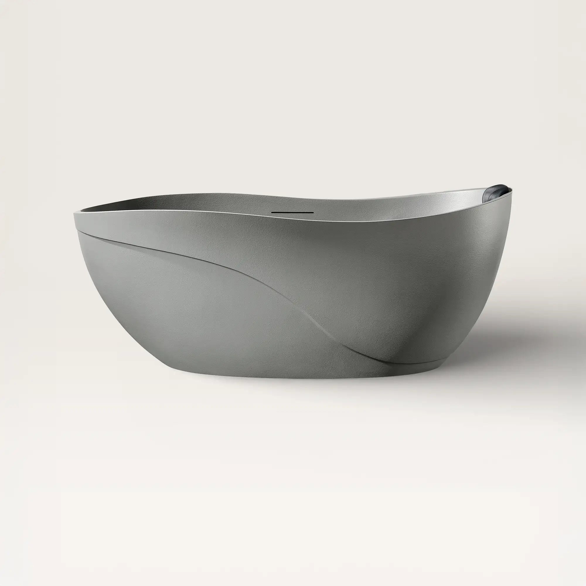 Front view of the Bellastone Soma freestanding bath in cement-grey with a black magnetic pillow
