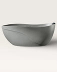 Front view of the Bellastone Soma freestanding bath in cement-grey with a black magnetic pillow