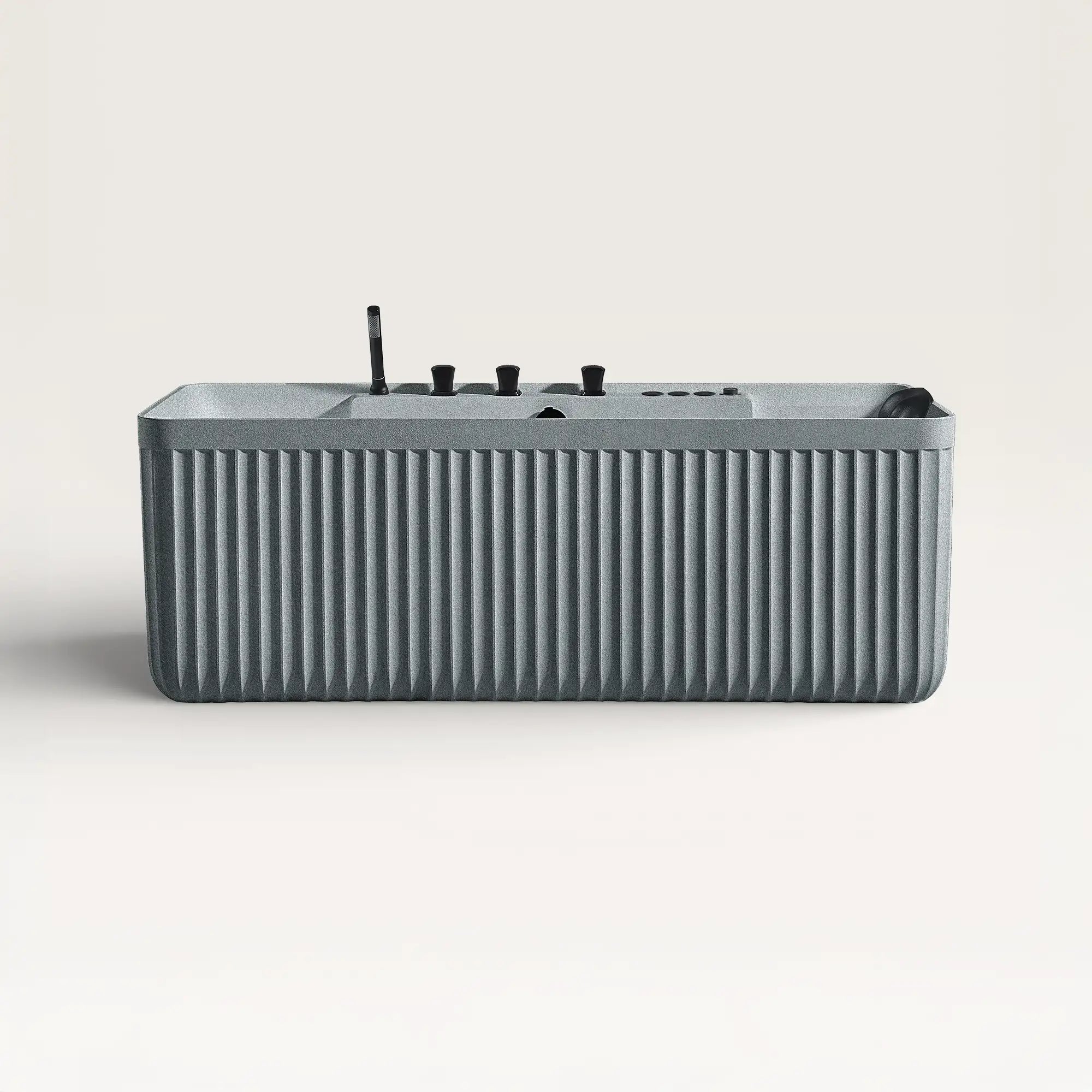Front view of the Bellastone Kolpa Spa bath with black tap ware in granite-grey