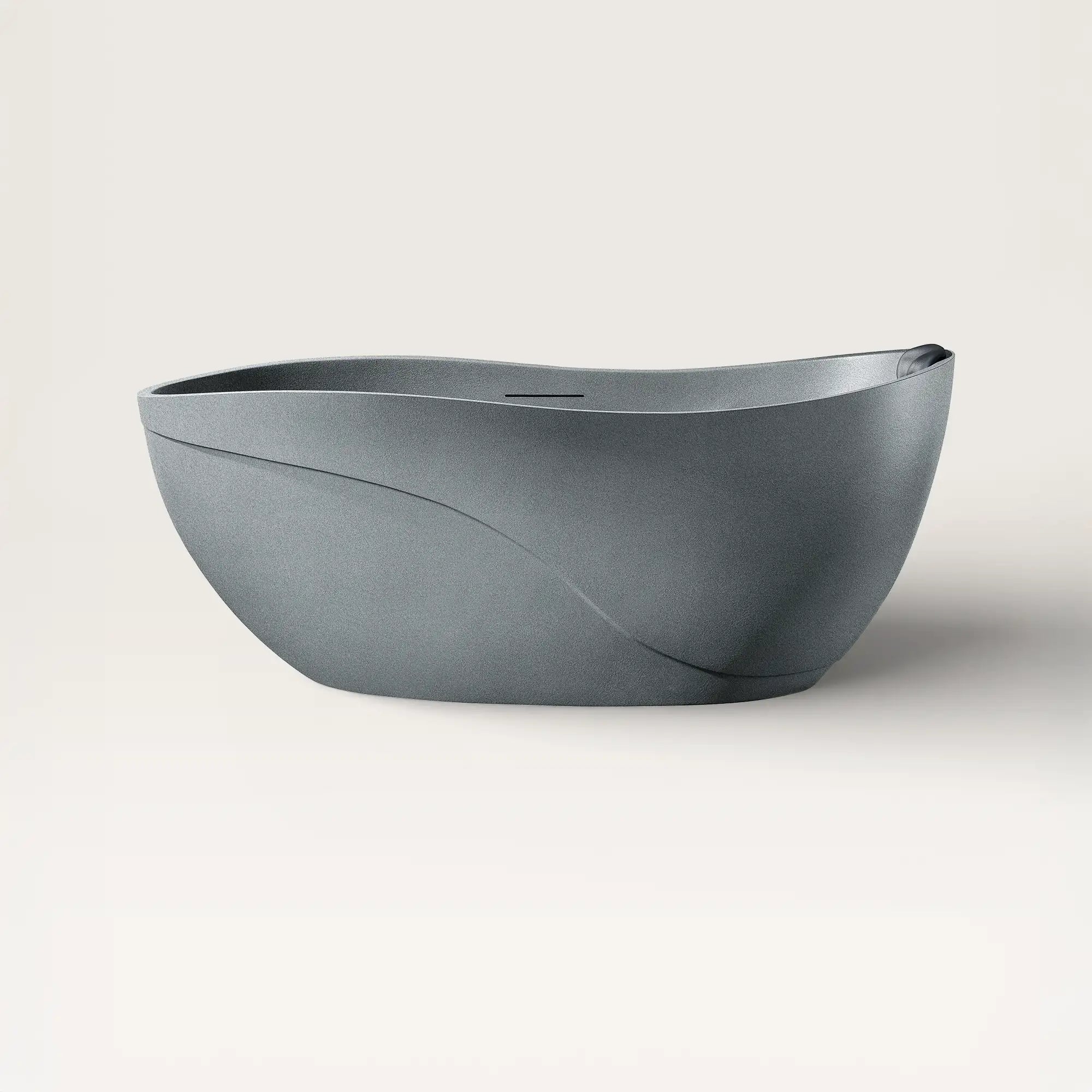 Front view of the Bellastone Soma freestanding bath in granite-grey with a black magnetic pillow