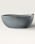 Front view of the Bellastone Soma freestanding bath in granite-grey with a black magnetic pillow