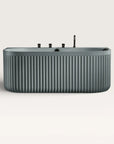 Front view of the Bellastone DORIA Back-to-Wall Bath with Faucet in blue-grey with black tap ware