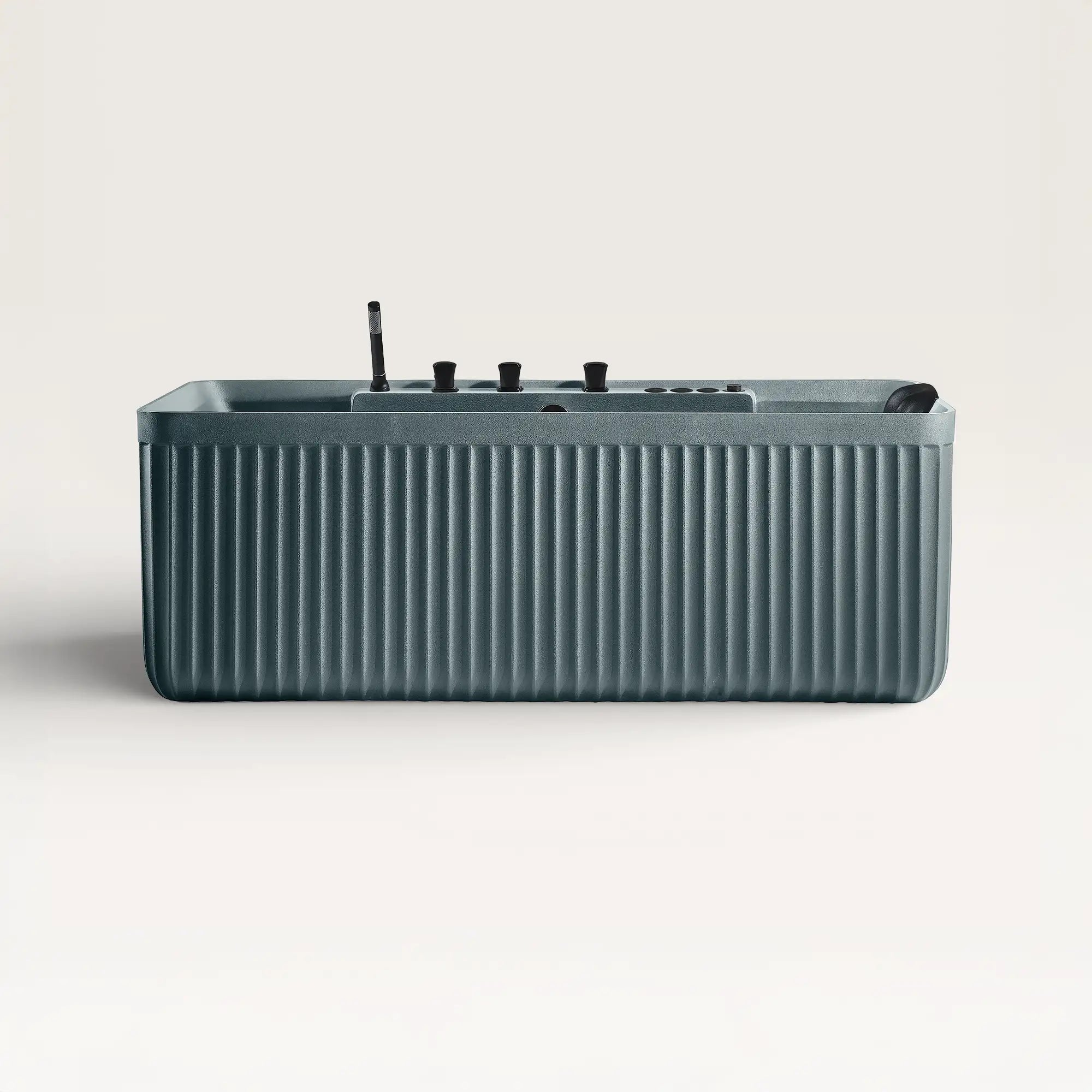 Front view of the Bellastone Kolpa Spa bath with black tap ware in blue-grey
