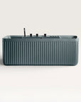 Front view of the Bellastone Kolpa Spa bath with black tap ware in blue-grey