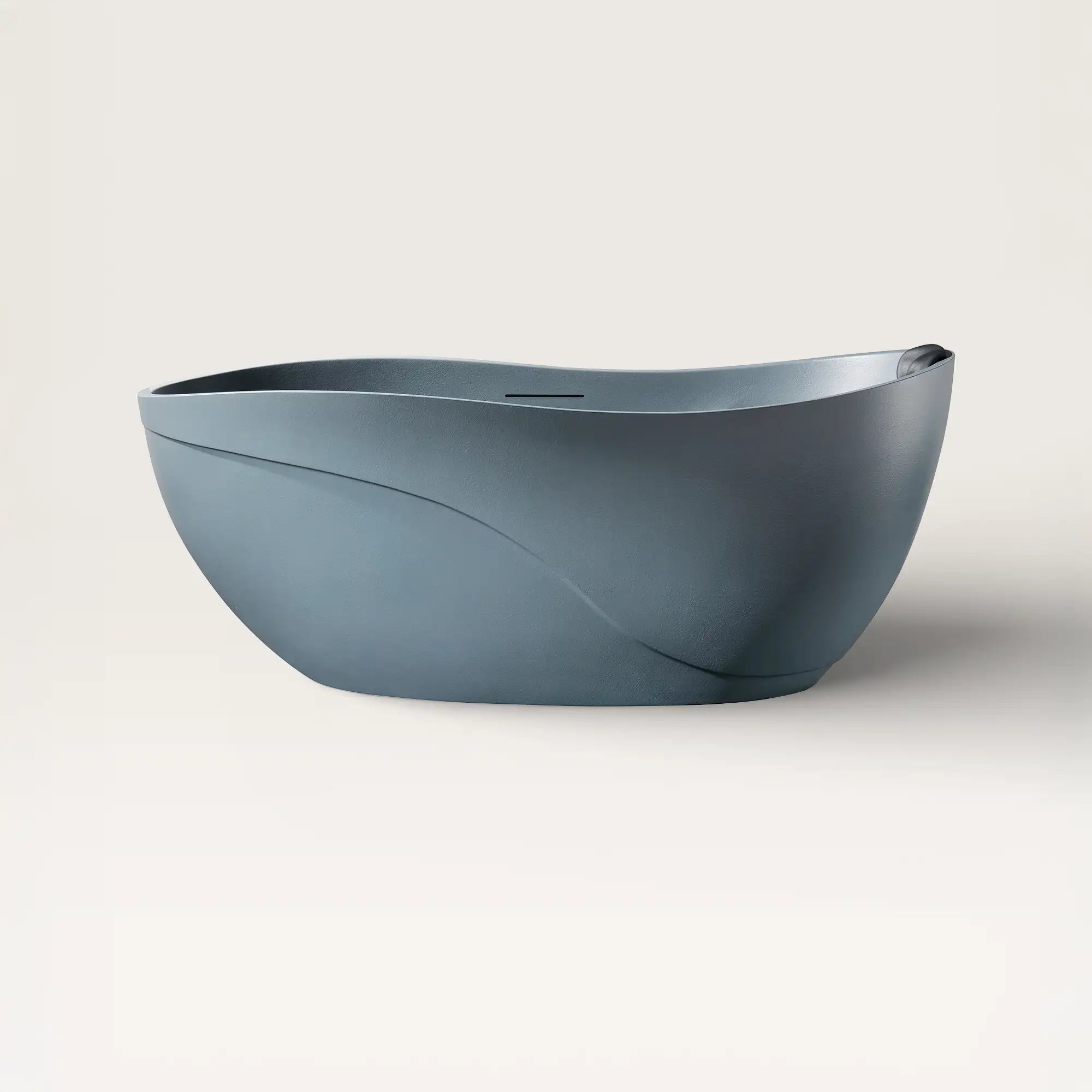 Front view of the Bellastone Soma freestanding bath in blue-grey with a black magnetic pillow