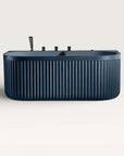 Front view of the Bellastone DORIA Spa Bath in prussian blue with black tap ware
