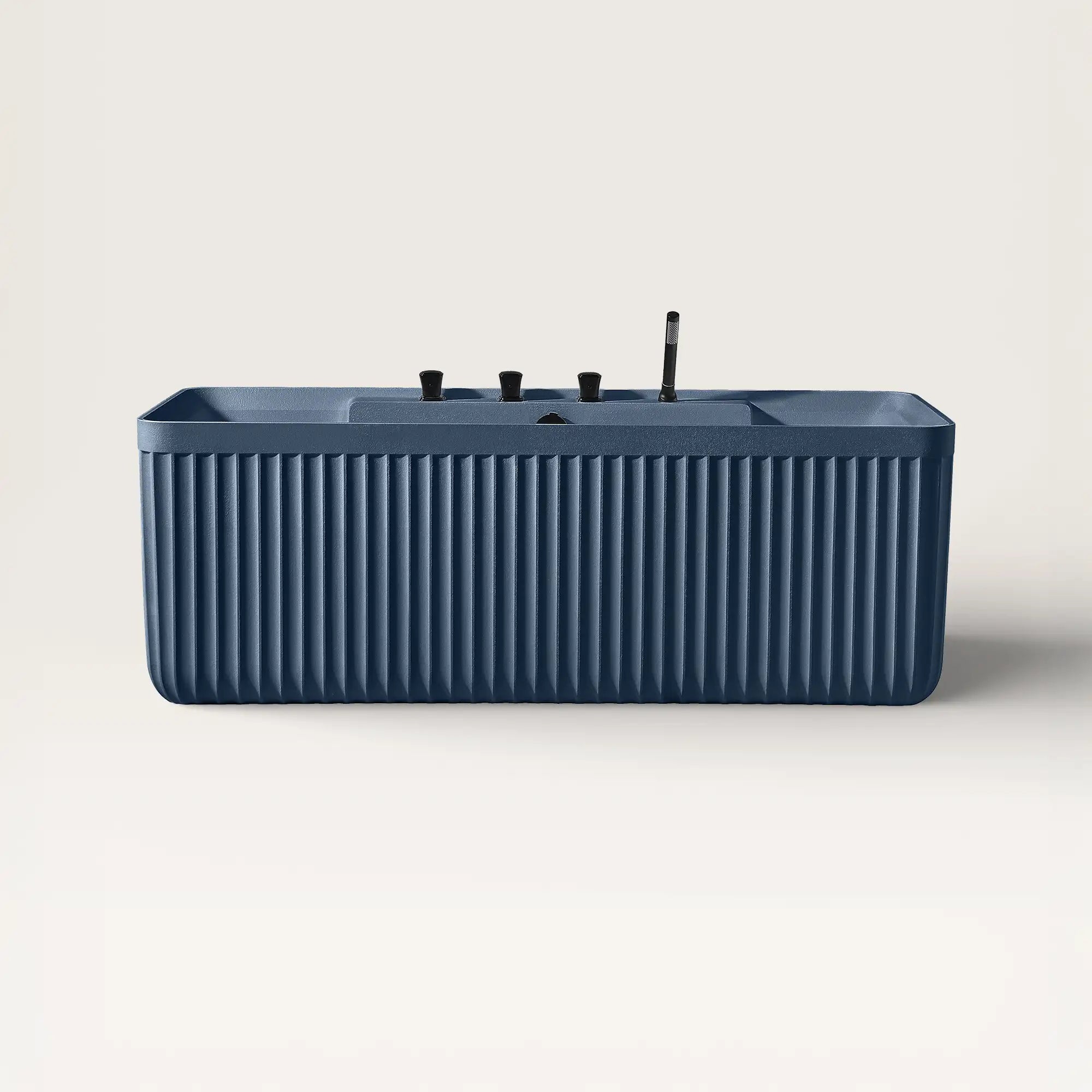 Front view of the Bellastone Kolpa back-to wall bath with black tap ware in prussian blue