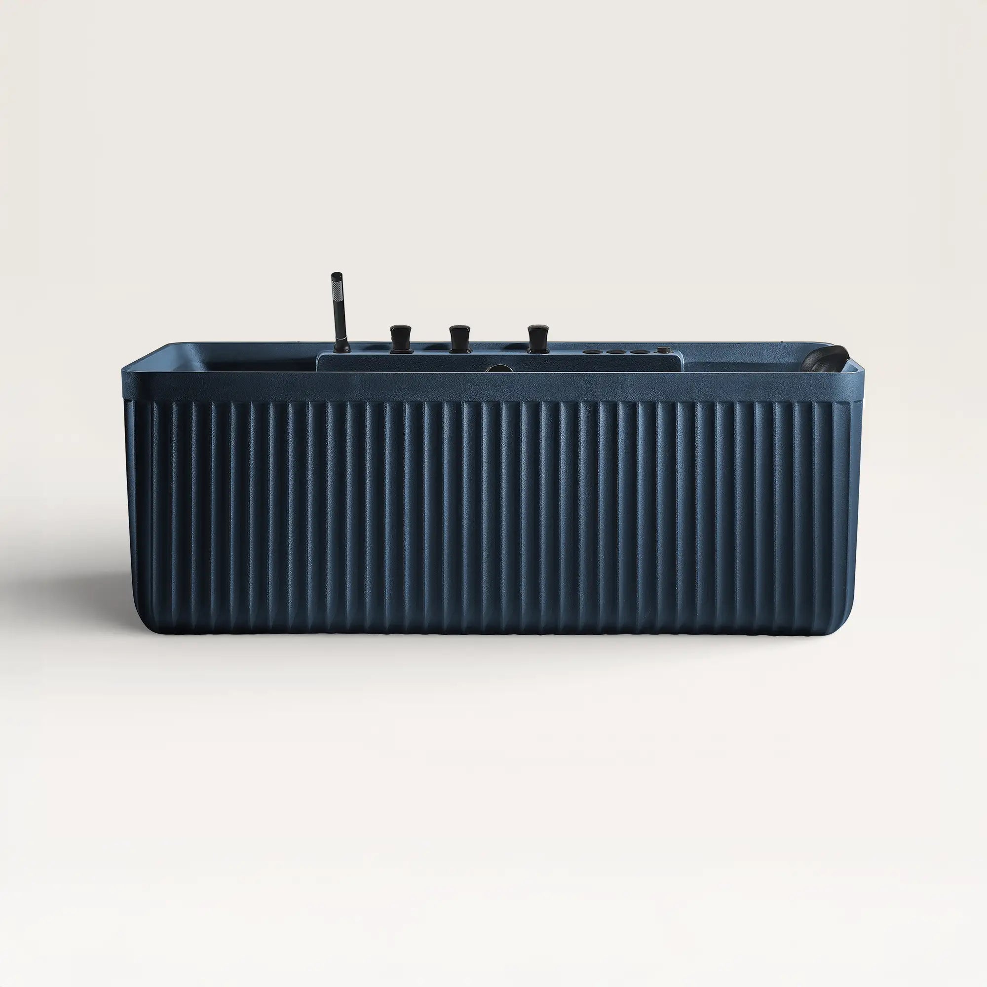 Front view of the Bellastone Kolpa Spa bath with black tap ware in prussian blue