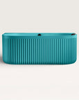 Front view of the Bellastone DORIA Back-to-wall Bath in celadon blue