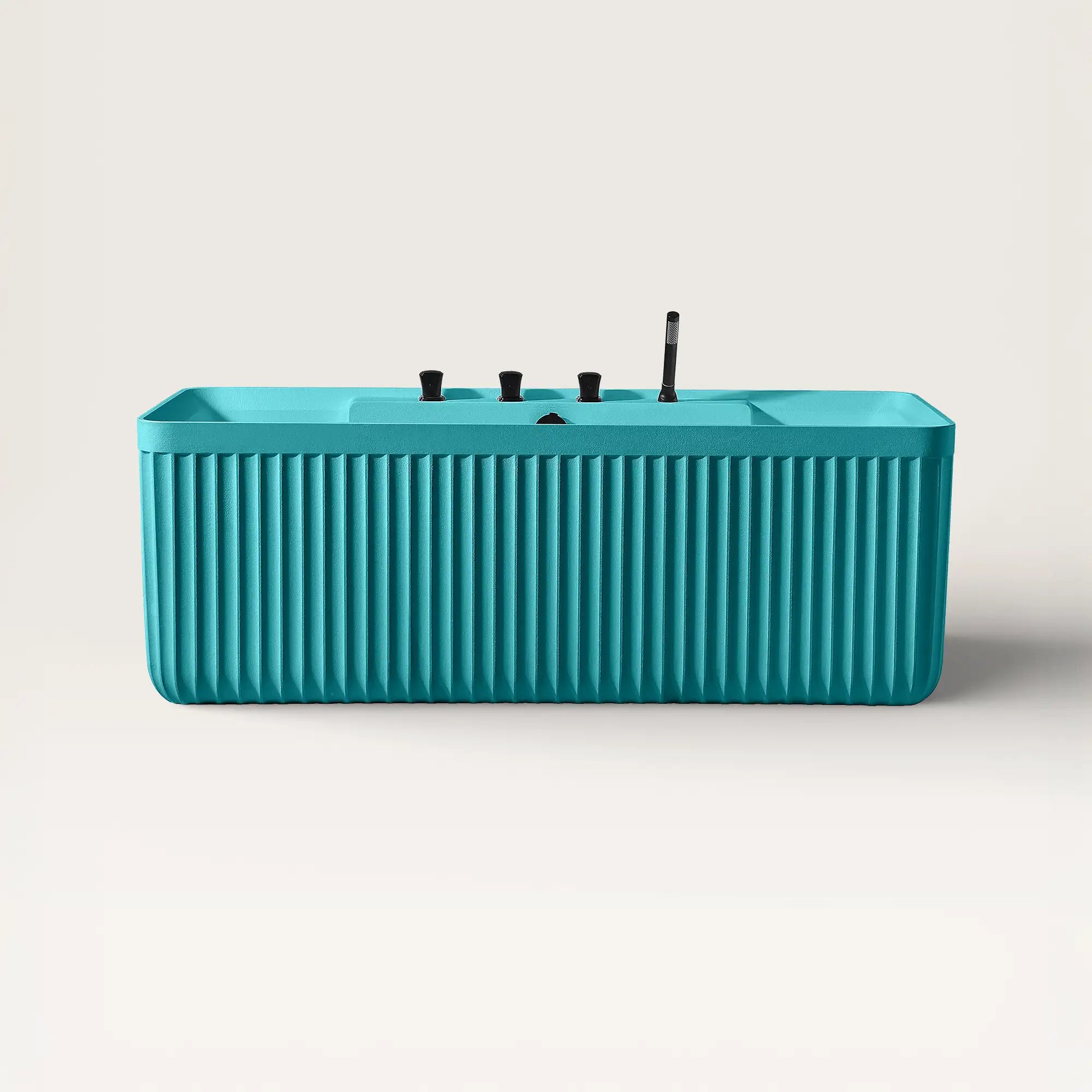 Front view of the Bellastone Kolpa back-to wall bath with black tap ware in celadon blue.