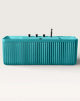 Front view of the Bellastone Kolpa back-to wall bath with black tap ware in celadon blue.
