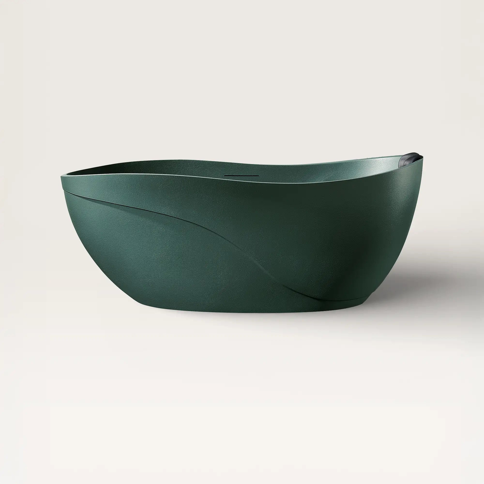 Front view of the Bellastone Soma freestanding bath in green with a black magnetic pillow