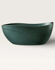 Front view of the Bellastone Soma freestanding bath in green with a black magnetic pillow