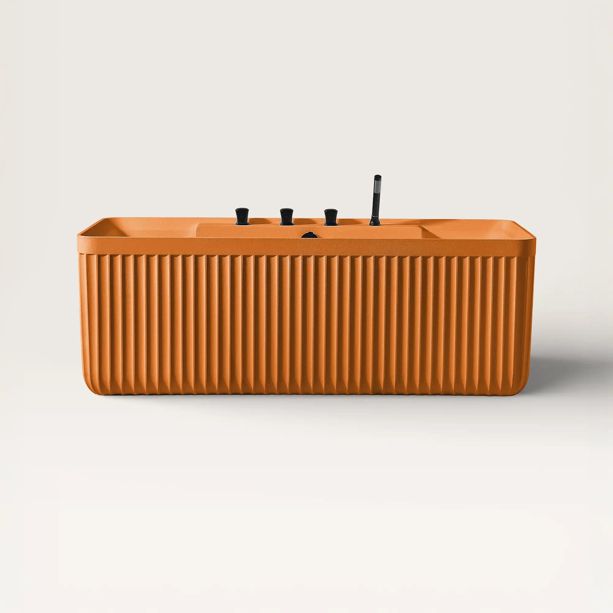 Front view of the Bellastone Kolpa back-to wall bath with black tap ware in orange