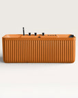 Front view of the Bellastone Kolpa Spa bath with black tap ware in orange