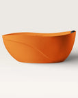 Front view of the Bellastone Soma freestanding bath in orange with a black magnetic pillow