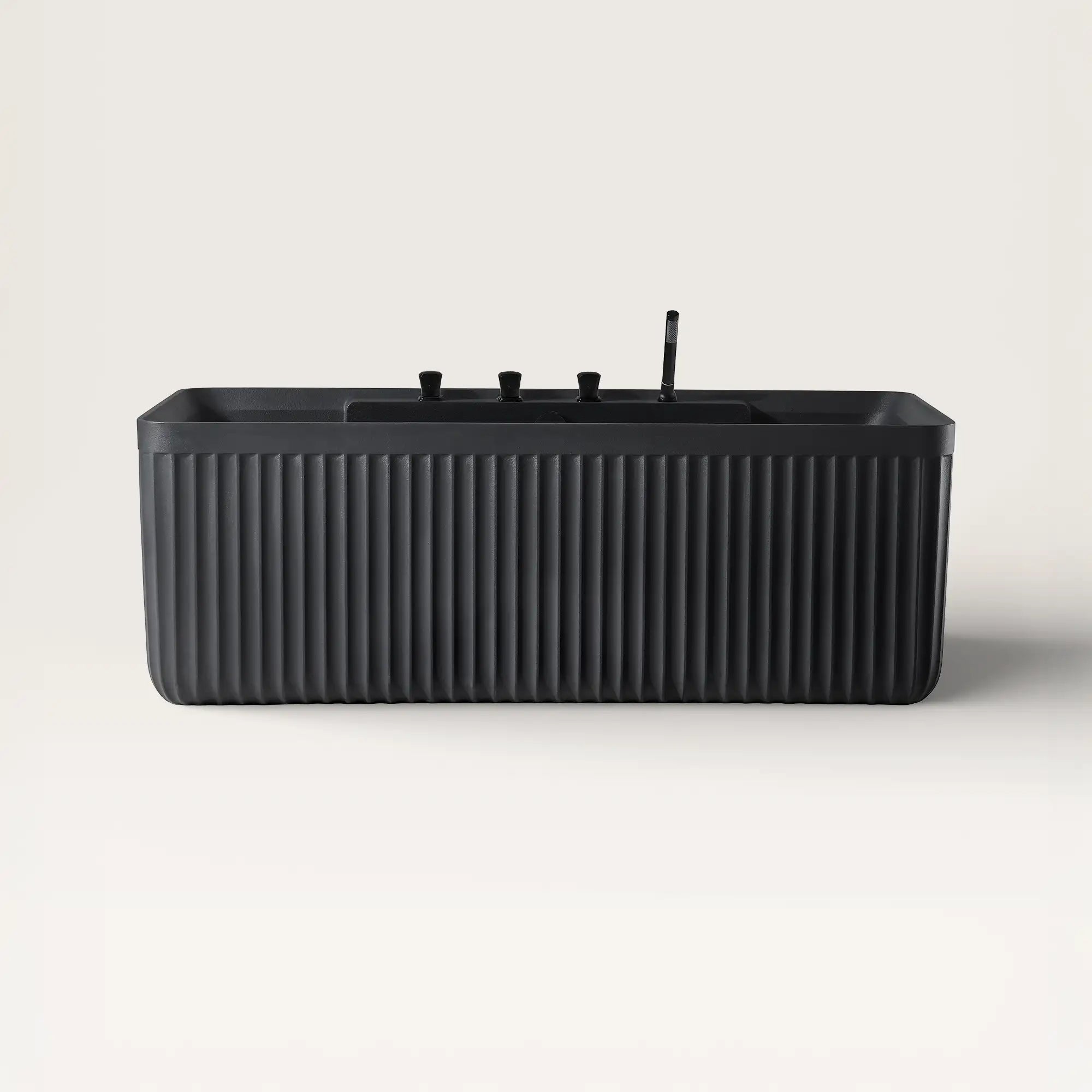 Front view of the Bellastone Kolpa back-to wall bath with black tap ware in black