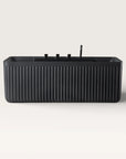 Front view of the Bellastone Kolpa back-to wall bath with black tap ware in black