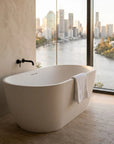 Freestanding bellastone mineral composite bath in Cream.