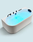 A top view of the Bellastone Doria spa bathtub in white with black tap ware, on a blue background