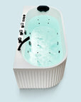 A top view of the Bellastone Doria spa bathtub in white with black tap ware, on a blue background