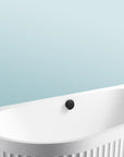 A close-up of the Bellastone Doria back-to-wall bathtub in white on a blue background
